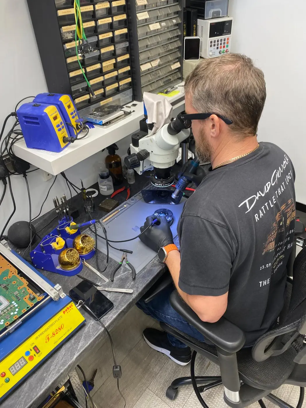 Colin carrying out a microsoldering repair at The Geeks Garage